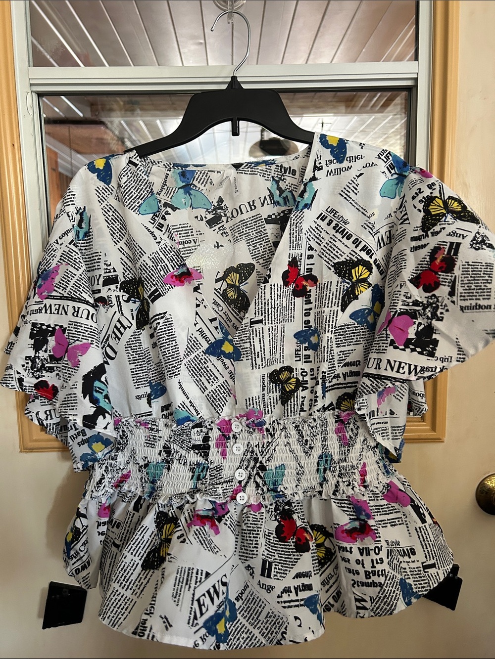 Newspaper Print Butterfly Peplum Blouse — White with Multicolor Butterflies